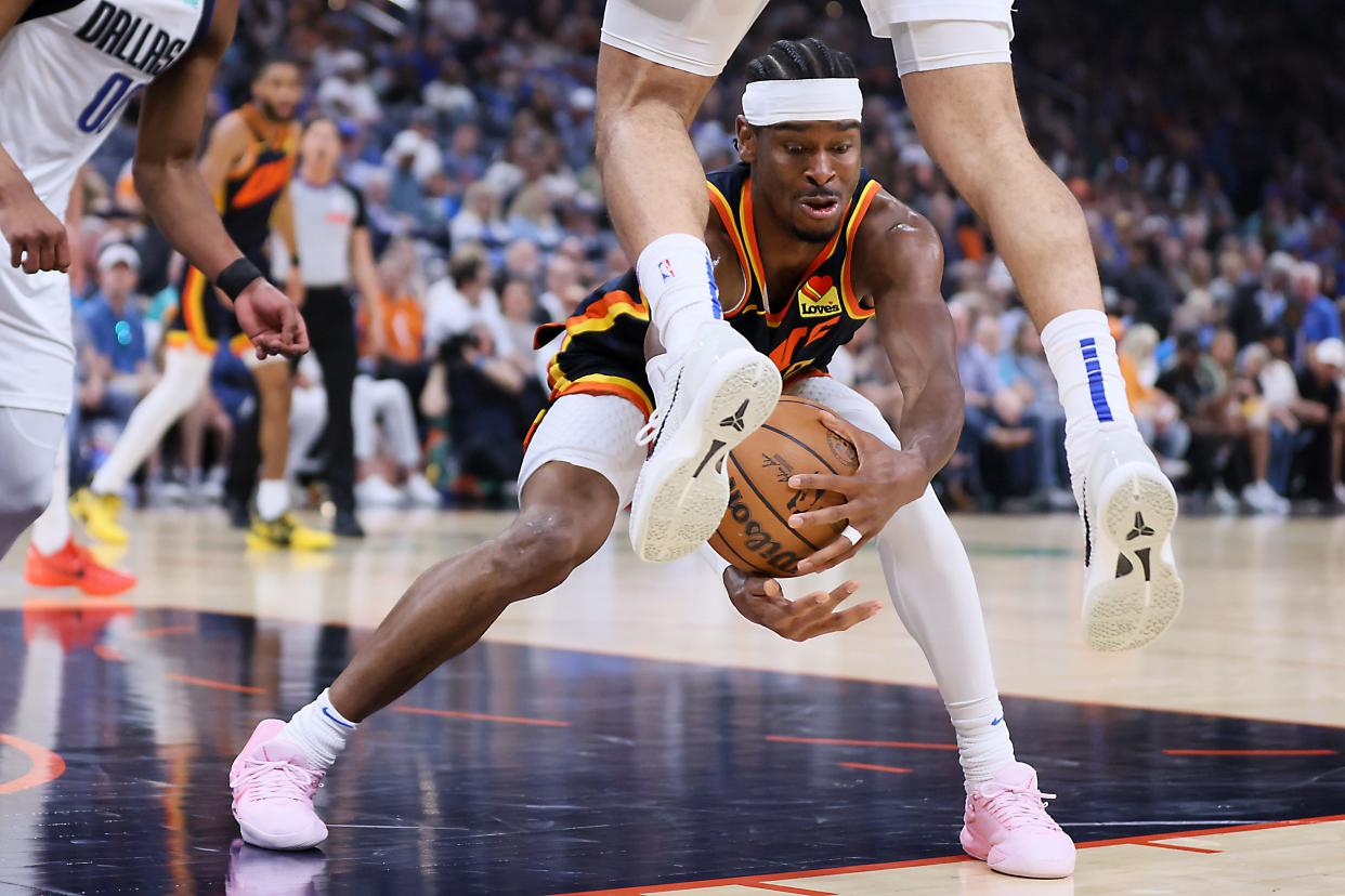 Thunder guard Shai Gilgeous-Alexander (2) reaches for the ball against the Mavericks on April 14 at Paycom Center.