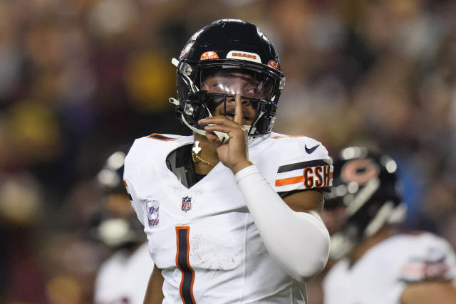 Chicago Bears quarterback Justin Fields (1) celebrates his one