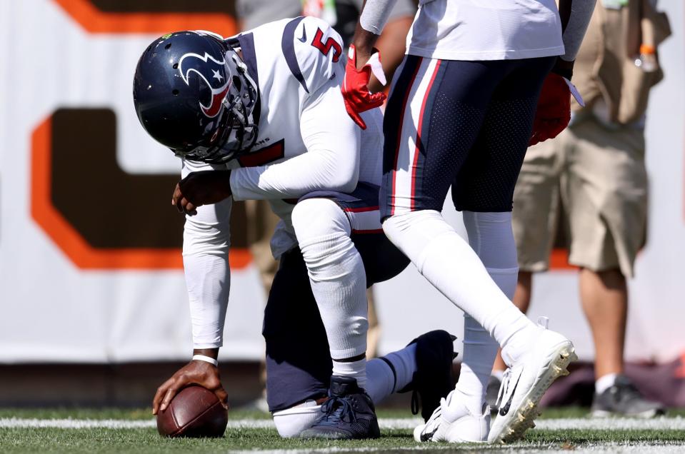 Quarterback Tyrod Taylor #5 of the Houston Texans kneels after scoring a touchdown during the first half in the game against the Cleveland Browns at FirstEnergy Stadium on September 19, 2021 in Cleveland, Ohio.