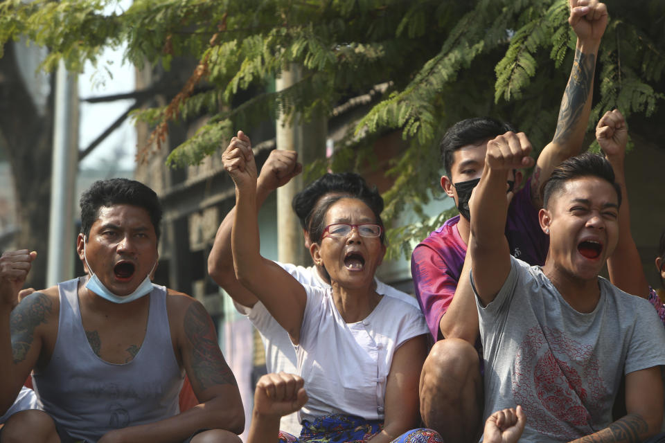 Protesters raise their hands with clenched fists during an anti-coup demonstration in Mandalay, Myanmar, Saturday, March 13, 2021. Myanmar's military seized power Feb. 1, hours before the seating of a new parliament following election results that were seen as a rebuff to the country's generals. (AP Photo)