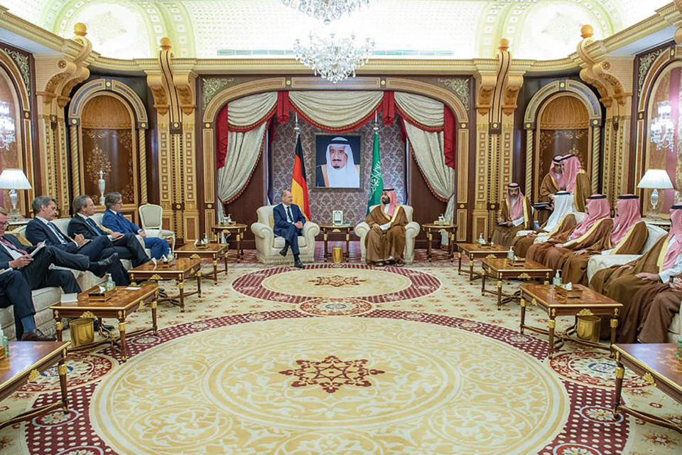 In this photo released by Saudi Press Agency, SPA, Saudi Crown Prince Mohammed bin Salman, right, center, talks to Chancellor Olaf Scholz, in Jeddah, Saudi Arabia, Saturday, Sept 24, 2022. (Saudi Press Agency via AP)