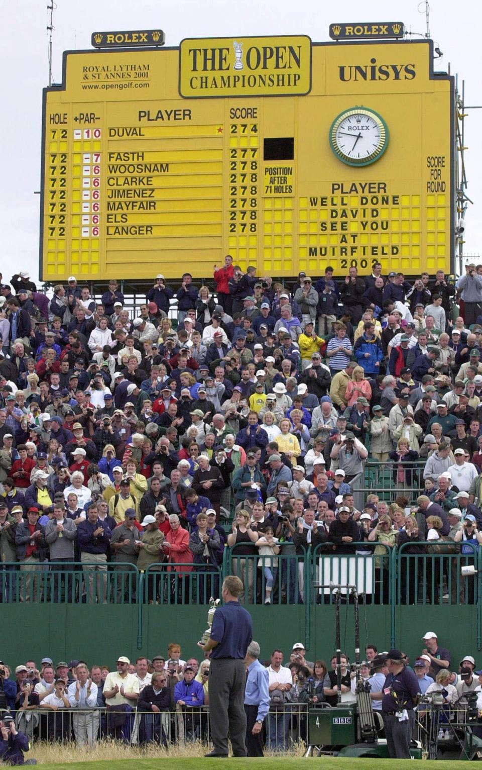 David Duval stands in front of the leaderboard at Royal Lytham and St. Annes on July 22, 2001, after winning the British Open.