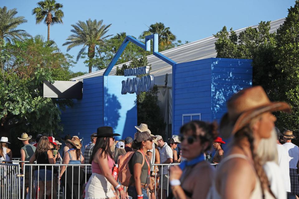 People wait in line to get inside the Bud Light Backyard theatre during Stagecoach country music festival at the Empire Polo Club in Indio, Calif., on Saturday, April 29, 2023.