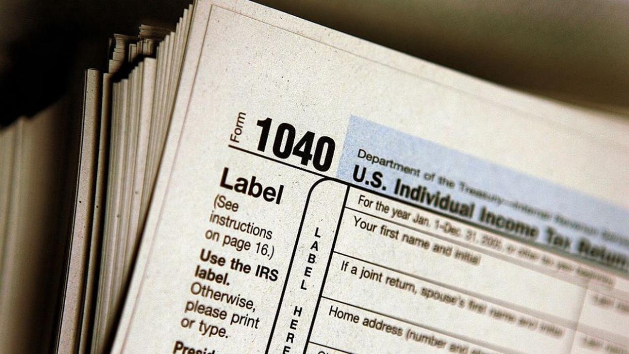 <div>FILE PHOTO. The top of a form 1040 individual income tax return. (Photo by Tim Boyle/Getty Images)</div>