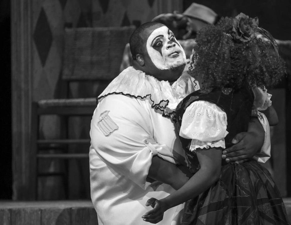 Opera singers Limmie Pulliam (Canio) stabs Kearstin Piper Brown (Nedda), right, during the climatic ending of ‘I pagliacci’ at the Adrienne Arsht Center in Miami. Carl Juste/cjuste@miamiherald.com