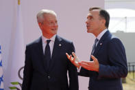French Finance Minister Bruno Le Maire, left, welcomes Canada's Finance Minister Bill Morneau, at the G-7 Finance Wednesday July 17, 2019.The top finance officials of the Group of Seven rich democracies are arriving at Chantilly, at the start of a two-day meeting aimed at finding common ground on how to tax technology companies and on the risk from new digital currencies. (AP Photo/Michel Euler)