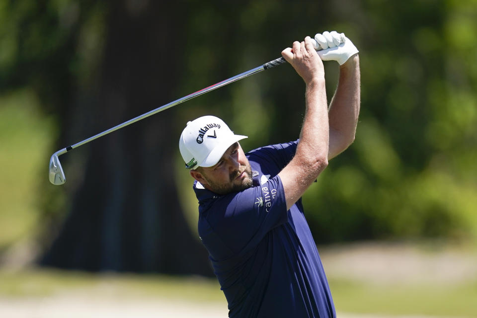 Marc Leishman, of Australia, hits on the second fairway during the final round of the PGA Zurich Classic golf tournament at TPC Louisiana in Avondale, La., Sunday, April 25, 2021. (AP Photo/Gerald Herbert)