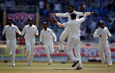 Cricket - India v Australia - Third Test cricket match - Jharkhand State Cricket Association Stadium, Ranchi, India - 20/03/17 - India's Ravindra Jadeja celebrates with his teammates after dismissing Australia's captain Steven Smith. REUTERS/Adnan Abidi