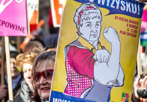 Polish feminists demonstrate in Warsaw during International Women's Day earlier this month. A revolution is under way in Poland as the government moves to cut large subsidies for Poland's powerful Catholic Church and give taxpayers more choice in funding it