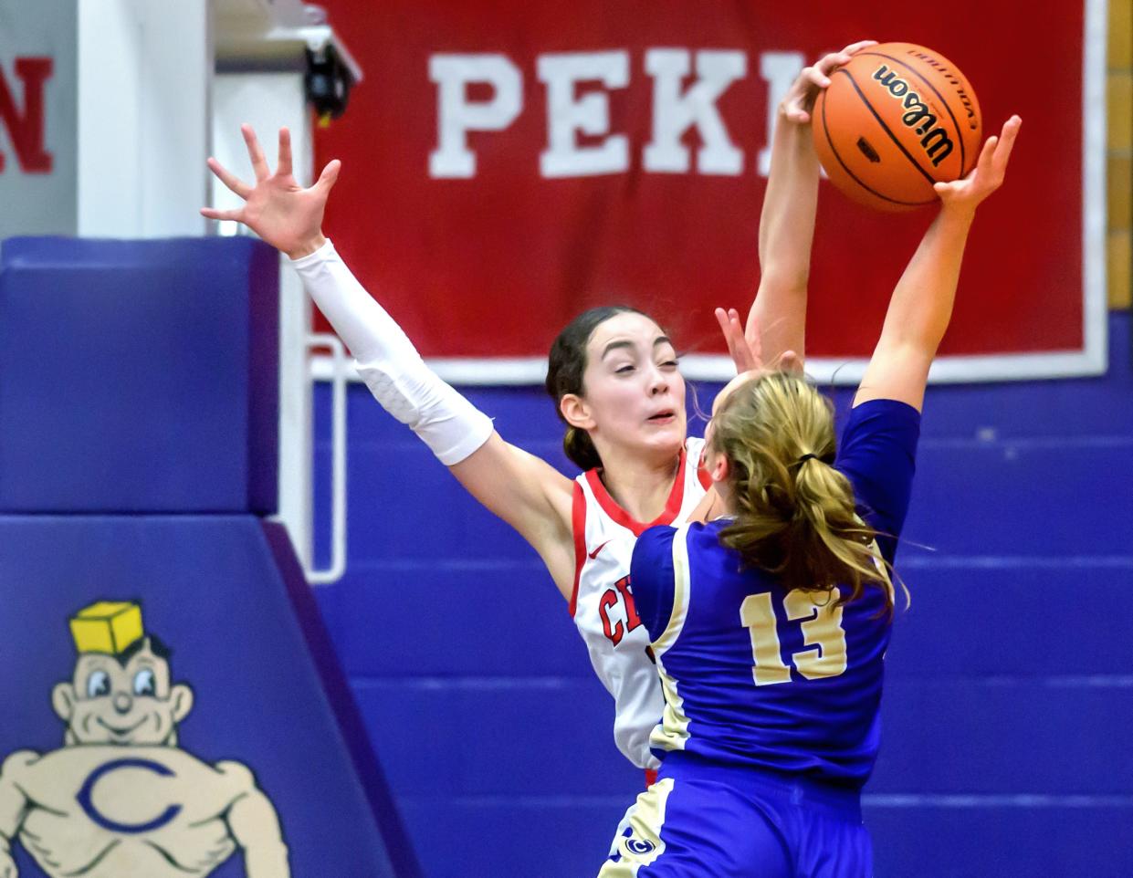 Dee-Mack's Dalia DeJesus blocks a shot from Canton's Jena Goforth in the first half of their Class 2A girls basketball sectional semifinal Tuesday, Feb. 20, 2024 at Ingersoll Gym in Canton. The Chiefs advanced to the final with a 44-34 win over the Little Giants.