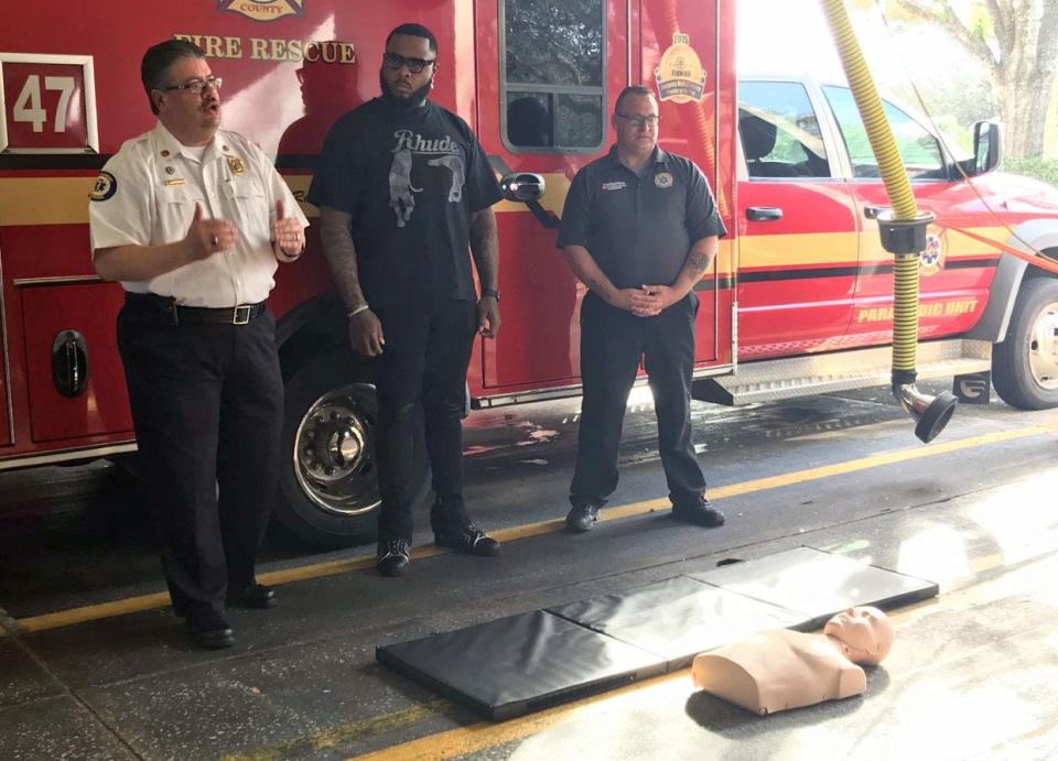 Jawaan Taylor, center, offensive lineman for the Jacksonville Jaguars, learns CPR at Brevard County Fire Rescue Station No. 47 on Tuesday.