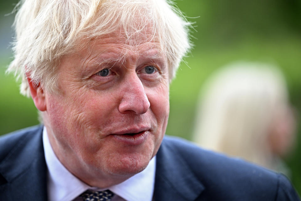 Prime Minister Boris Johnson talks to local business people after a regional cabinet meeting at Middleport Pottery in Stoke on Trent. Picture date: Thursday May 12, 2022.