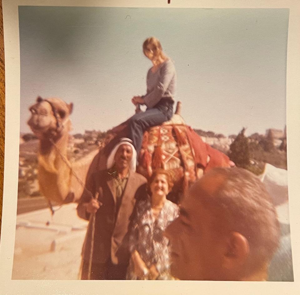 Victoria Hochman sits on a camel in Jerusalem during a visit there with her mother, Helen.