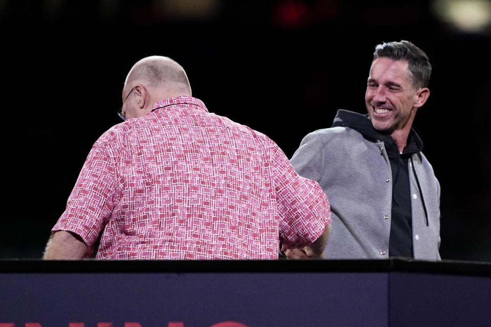 San Francisco coach Kyle Shanahan and Kansas City coach Andy Reid shake hands during Super Bowl media access.