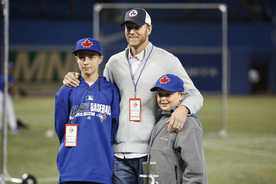 Braden Halladay, left, with his late father Roy Halladay, is now eligible for the MLB Draft. (Carlos Osorio/Toronto Star via Getty Images)