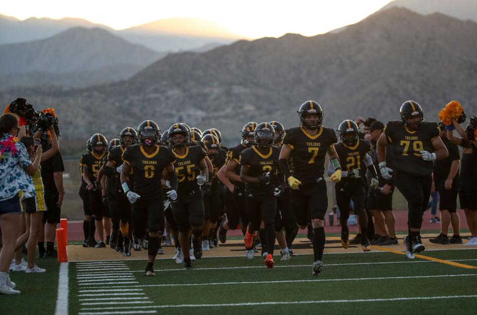 The Yucca Valley Trojans take the filed against Valley View in Yucca Valley, Calif., August 31, 2023.