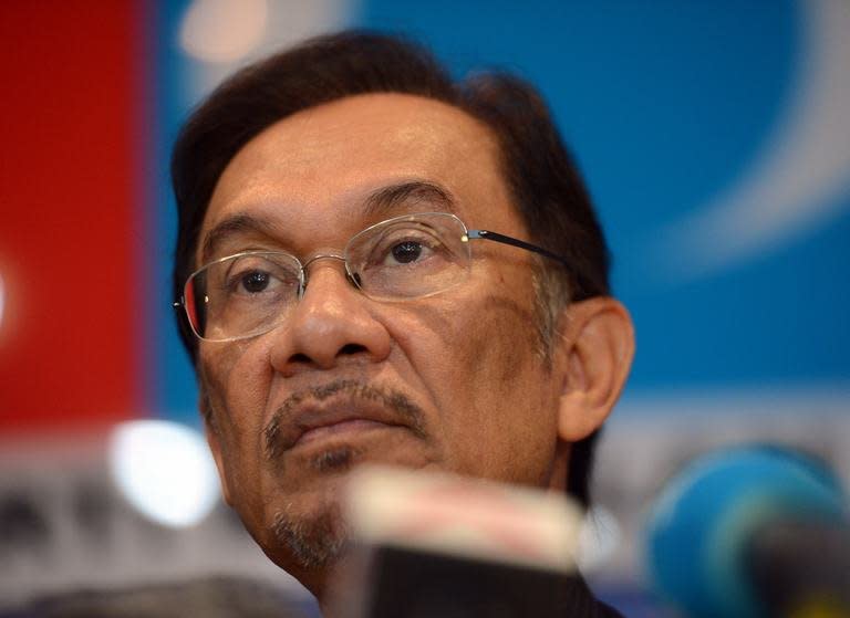 Opposition leader Anwar Ibrahim holds a press conference at his party head office in Petaling Jaya on May 7, 2013. Malaysian police have declared illegal a rally planned for Wednesday night by the opposition leader to protest against election results that he says were "stolen" through massive fraud