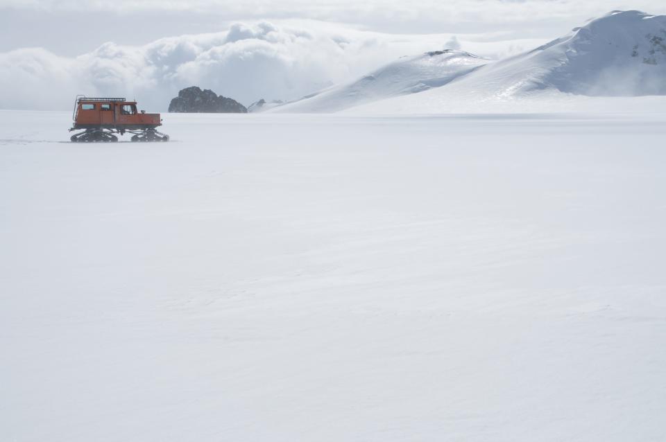 Researchers traverse the Pine Island Glacier on the West Antarctic ice sheet, where scientists from the British Antarctic Survey are studying the effects of warmer water underneath the ice.