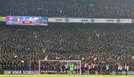 Feyenoord players celebrate winning their Europa League soccer match against Sevilla in Rotterdam November 27, 2014. REUTERS/Michael Kooren