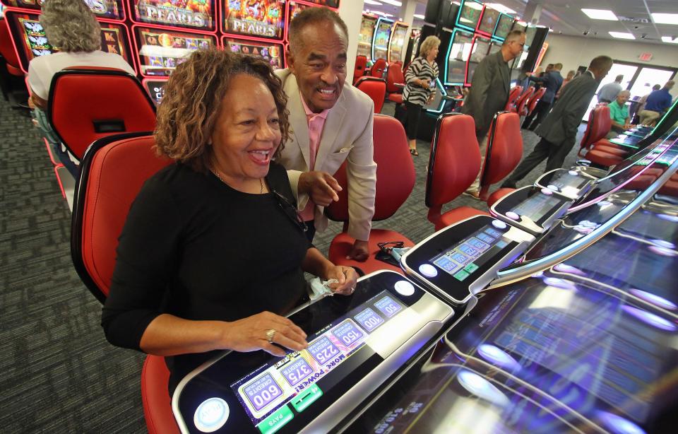 Ann Clarke and Gus Harrison try their luck after the ribbon cutting ceremony for the Catawba Two Kings Casino pre-launch facility Thursday morning, July 1, 2021.