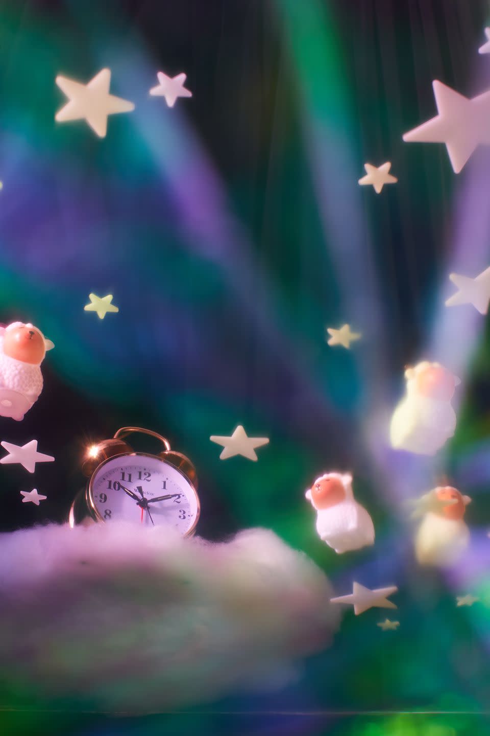 a clock cloud and plastic sheep in dreamy setting