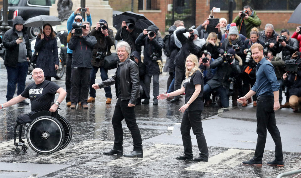 Prince Harry, Duke of Sussex (R), Jon Bon Jovi (second left) and members of the Invictus Games Choir pose on the crossing at Abbey Road Studios on Feb. 28, in London. (Photo: Chris Jackson via Getty Images)