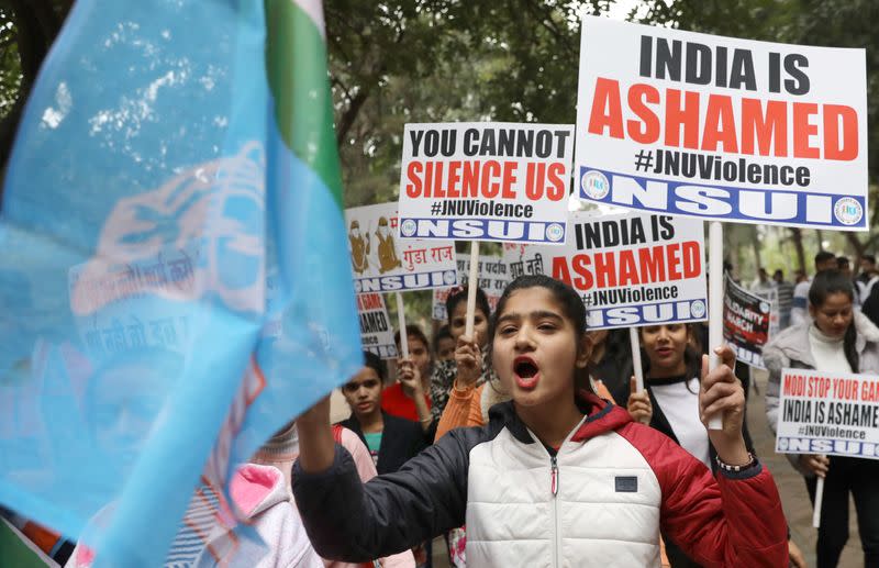 Members of National Students' Union of India (NSUI), the student wing of India's main opposition Congress party, shout slogans during a protest against the attacks on the students of Jawaharlal Nehru University (JNU) on Sunday, in New Delhi