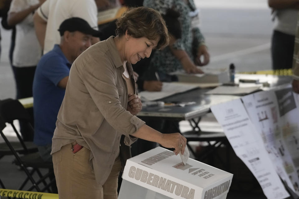 Delfina Gomez, Mexico state gubernatorial candidate for the National Regeneration Movement, or MORENA, casts her vote on a polling station in Texcoco, Mexico state, Sunday, June 4, 2023. (AP Photo/Eduardo Verdugo)