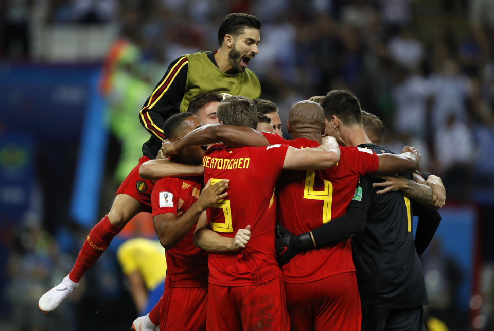 <p>Belgian players celebrate after upsetting Brazil 2-1 in the World Cup quarter finals </p>