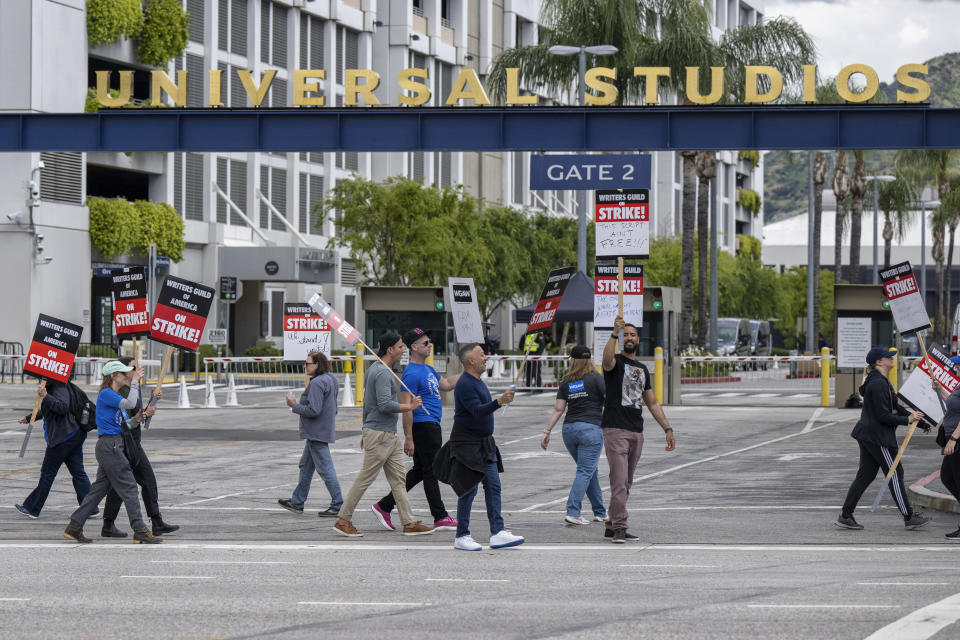 People picket during a Writers Guild of America demonstration outside of Universal Studios in Universal City, Calif., Friday, May 5, 2023. (Hans Gutknecht/The Orange County Register via AP)