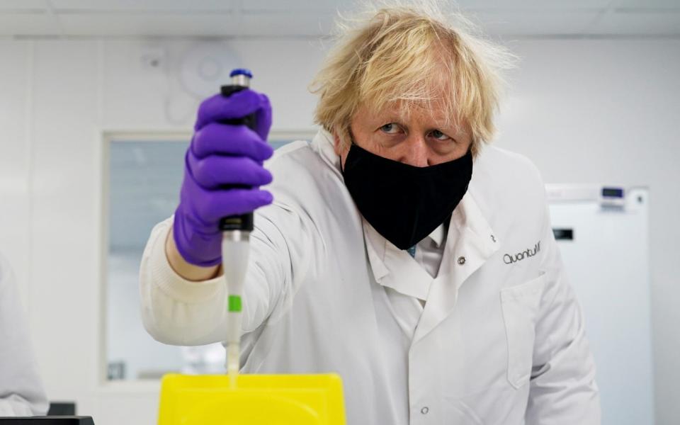 Britain's Prime Minister Boris Johnson, wearing a face mask to prevent the spread of the coronavirus disease, visits the QuantuMDx Biotechnology company, in Newcastle - Ian Forsyth/Pool via Reuters/File Photo