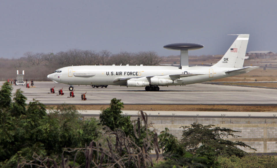 FILE - In this Dec. 14, 2006, file photo, a US military plane lands at the US base airport in Manta, Ecuador. Shortly after first taking officein 2007, Ecuadoran President Rafael Correa purged Ecuador's military of officers deemed to have close relations with U.S. counterparts. He also ended an agreement with Washington that allowed U.S. drug interdiction flights to be based at the Ecuadorean airfield in Manta. Ecuador has ordered, on April 2014, that all 20 Defense Department employees in the U.S. Embassy’s military group to leave the country by month’s end, The Associated Press has learned. (AP Photo/Dolores Ochoa, File)