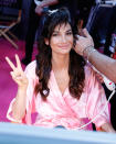 <p>Lily Aldridge flashed a peace sign from her makeup station. <em>(Photo: Getty Images)</em> </p>