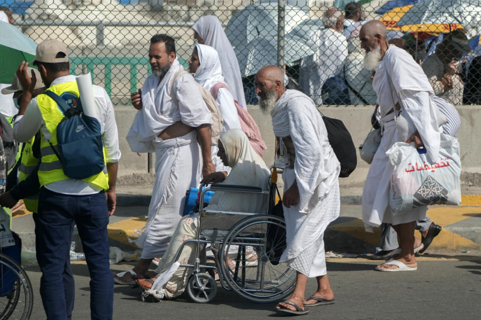 Pilgrims walk at Mina tent camp during the annual Hajj pilgrimage, near the holy city of Mecca, Saudi Arabia, Wednesday, June 28, 2023. Around two million pilgrims are converging on Saudi Arabia's holy city of Mecca for the largest Hajj since the coronavirus pandemic severely curtailed access to one of Islam's five pillars. (AP Photo/Amr Nabil)