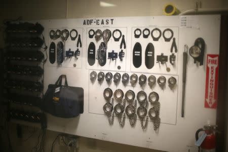 Handcuffs for employees to use are seen at the entrance of the Adelanto immigration detention center, which is run by the Geo Group Inc (GEO.N), in Adelanto, California, U.S., April 13, 2017. REUTERS/Lucy Nicholson