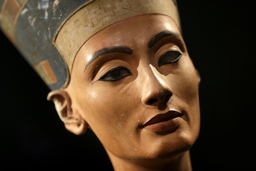 The Nefertiti bust is pictured during a press preview of the exhibition 'In The Light Of Amarna' at the Neues Museum in Berlin, Germany, Wednesday, Dec. 5, 2012 due to the 100th anniversay of the discovery of the bust of the Nefertiti. (AP Photo/Michael Sohn, pool)