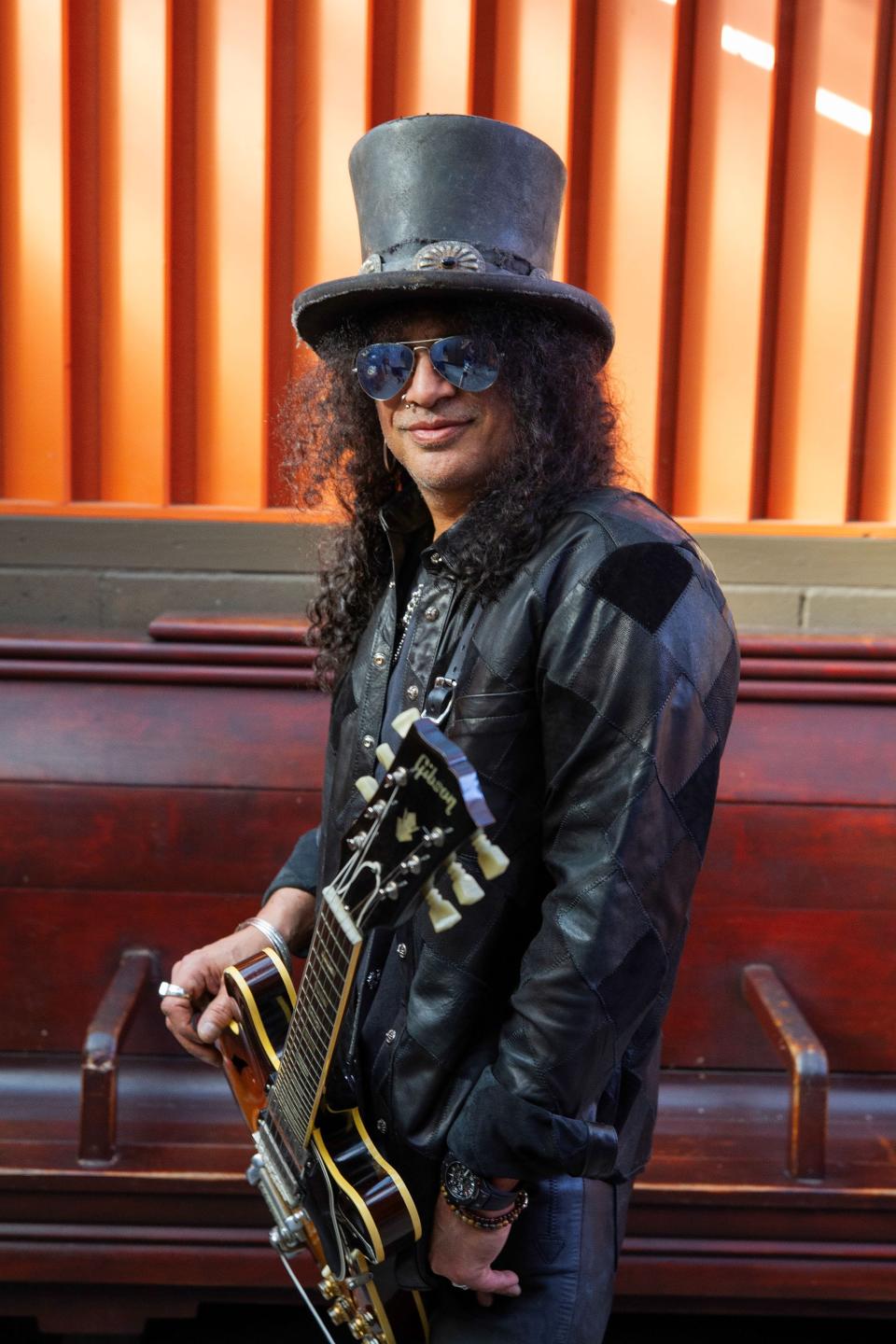 Rock guitarist Slash, pictured here with his Gibson ES-335 guitar.