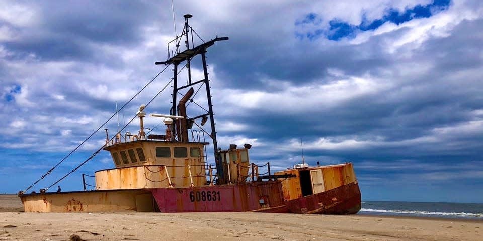 This photo provided by National Park Service shows the fishing vessel Ocean Pursuit stranded along the Cape Hatteras National Seashore in North Carolina on April 12, 2020.