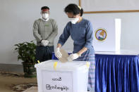 Myanmar's leader Aung San Suu Kyi makes an early voting for upcoming Nov. 8 general election at Union Election Commission office, Thursday, Oct. 29, 2020, in Naypyitaw, Myanmar. (AP Photo/Aung Shine Oo)