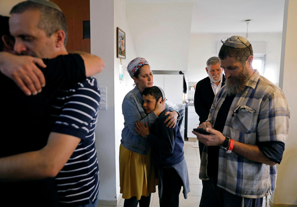 Members of the Israeli Aldar family react inside their home during an operation by Israeli forces to evict residents from several homes in the Israeli settlement of Ofra, in the occupied West Bank