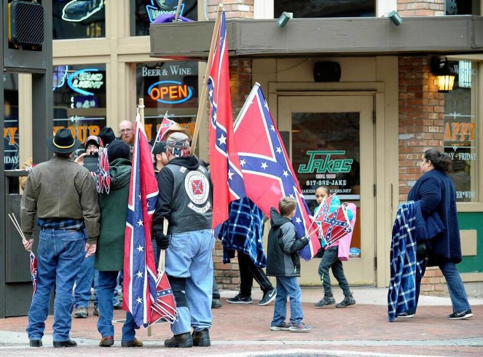 For the second year in a row, activists handed out Confederate flags at Saturday’s All Western Parade in downtown Fort Worth, the kick-off event for the Fort Worth Stock Show.