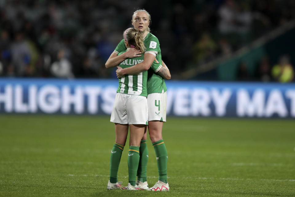 Ireland's Louise Quinn embraces Ireland's Denise O'Sullivan after the Women's World Cup Group B soccer match between Canada and Ireland in Perth, Australia, Wednesday, July 26, 2023. Canada won the match 2-1. (AP Photo/Gary Day)