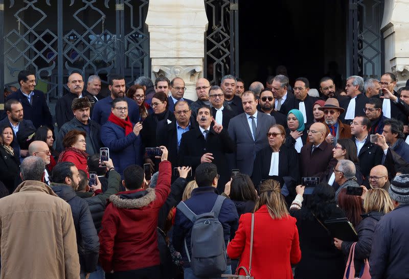 Tunisian prominent activist, Ayachi Hammami, speaks outside a court in Tunis