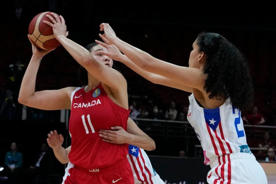 Canada's Natalie Achonwa, left, scored 16 points during a 77-68 win over Puerto Rico on Sunday in FIBA Women's Olympic Pre-Qualifying Tournament action in Medellín, Colombia.