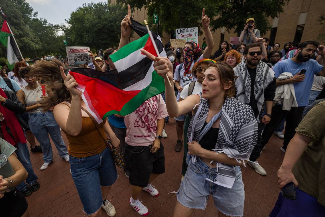 Lisa Valenzuela, a sophomore at University of North Texas, dances to the chants in support of Palestine for the Campus Wide Walkout for Gaza at the campus Library mall on Tuesday, April 30, 2024.