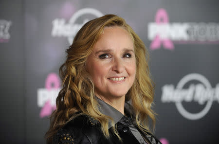 FILE PHOTO: Singer Melissa Etheridge poses for photographers after receiving a star on the Hollywood Walk of Fame in Los Angeles September 27, 2011. REUTERS/Phil McCarten/File Photo