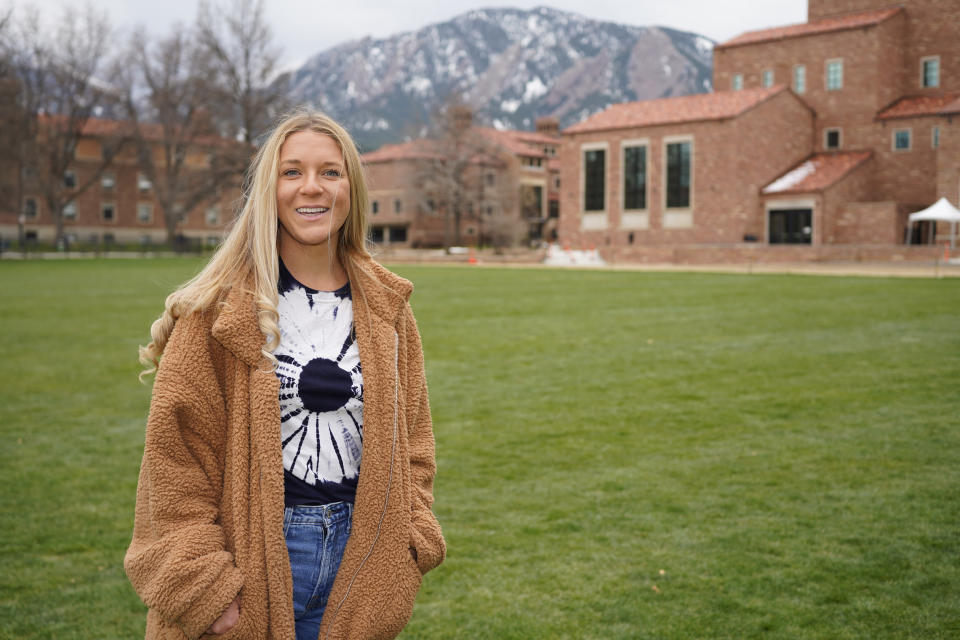 In this April 23, 2021, photo Sydney Kramer, a graduate student at the University of Colorado, poses for a photo on the campus in Boulder, Colo. Kramer is typical of many new Colorado arrivals. The 23-year-old moved to the university town of Boulder in January to begin graduate studies in atmospheric and oceanic sciences. She could have stayed in Miami, a natural location for someone of her interests and where she finished her undergraduate studies. But Kramer was depressed by Florida's anti-science turn under Republican state control. (AP Photo/David Zalubowski)