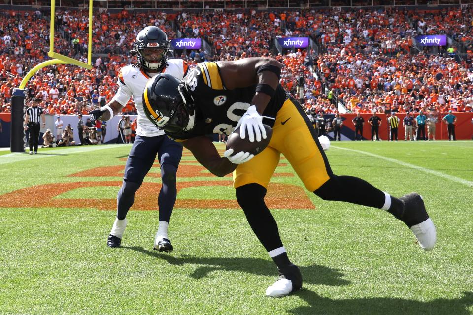 DENVER, COLORADO - SEPTEMBER 15: Darnell Washington #80 of the Pittsburgh Steelers scores a touchdown during the first half against the Denver Broncos at Empower Field At Mile High on September 15, 2024 in Denver, Colorado. (Photo by Matthew Stockman/Getty Images)