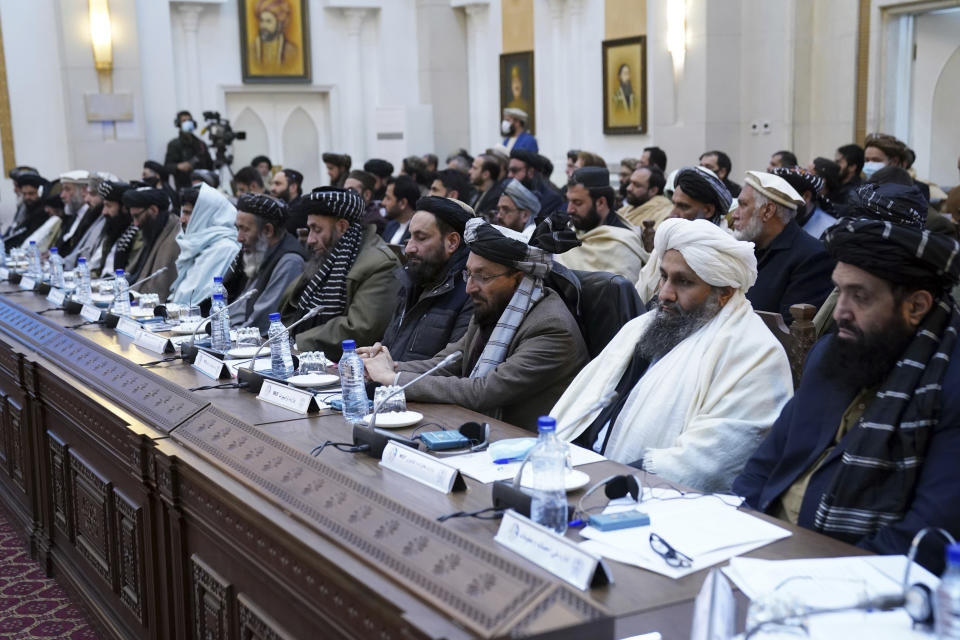 Taliban officials listen as Taliban Prime Minister Mohammad Hasan Akhund speaks during an economic conference at the former Presidential Palace in Kabul, Afghanistan, Wednesday, Jan. 19, 2022. Afghanistan's Taliban rulers are holding their first economic conference, five months since taking over the country that is now teetering on the verge of a humanitarian catastrophe and economic collapse. The U.N. head of mission for Afghanistan said at the gathering on Wednesday that surprising $1 billion in exports. (Taliban Prime Minister Media Office via AP)