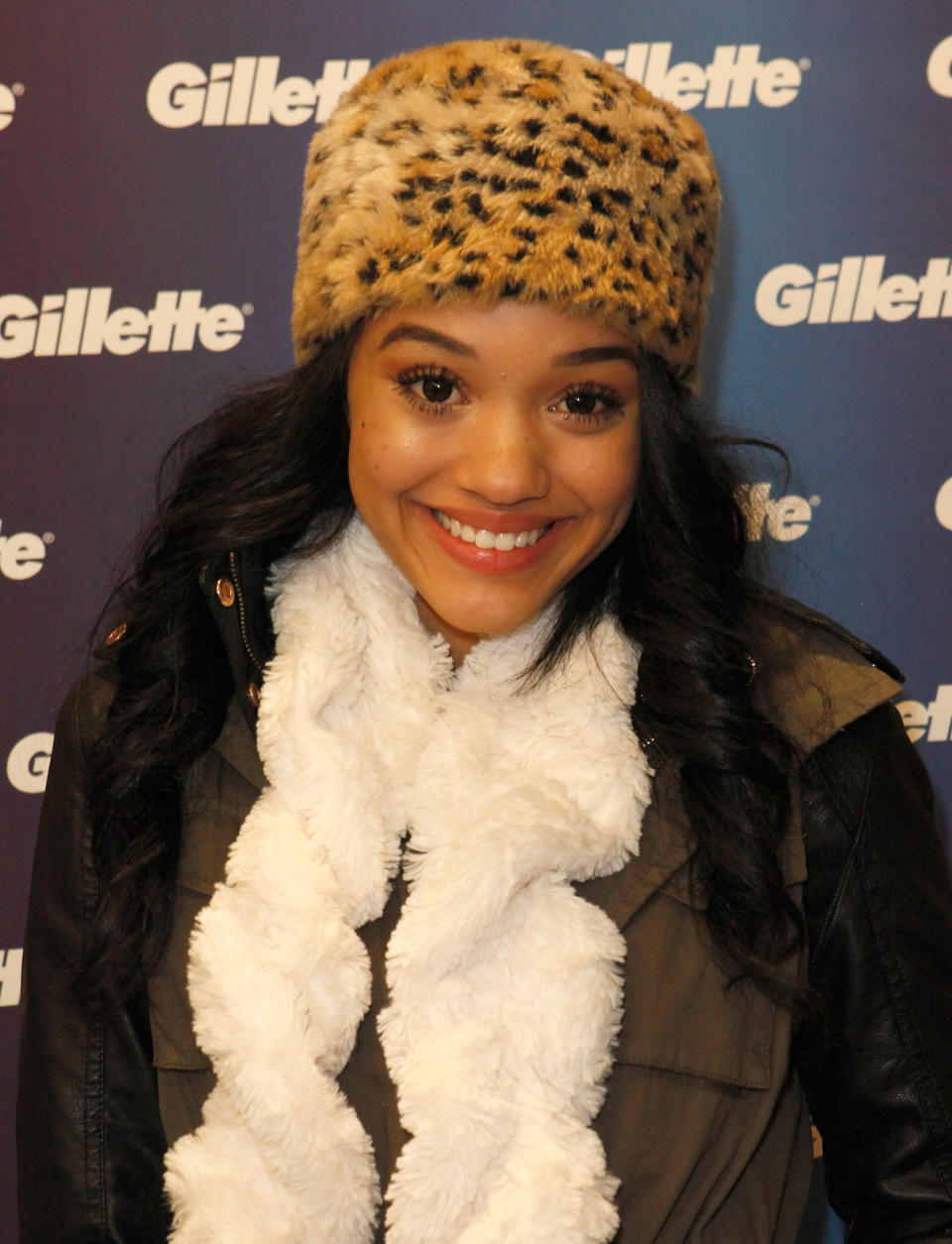 Kiersey in a fur hat smiling